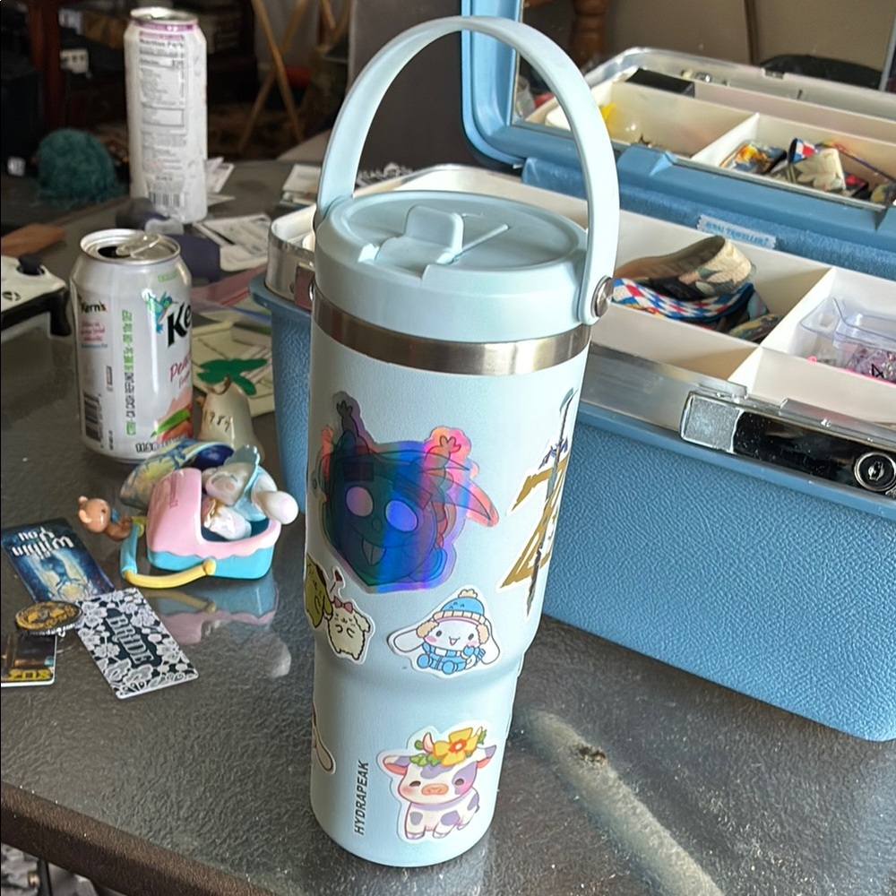 Light Blue Tumbler with Stickers